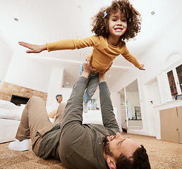 Image showing Father, child and airplane game on floor in home living room, bonding and love for care, relax or smile. Dad, girl kid or lift for plane, playing or happy on lounge carpet, portrait and family house