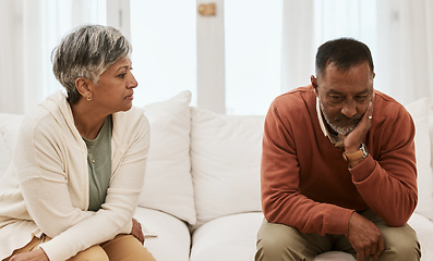 Image showing Divorce, fight and senior couple on sofa angry, stress and mistake, problem or issue in their home. Marriage, argue and frustrated old woman with man in living room for debt, depression or addiction