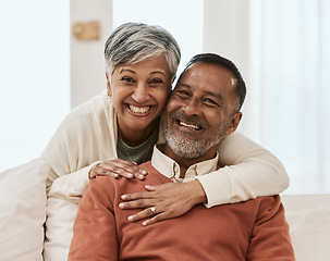 Image showing Smile, portrait and senior couple hug on sofa in living room relax, laugh and bond in their home. Face, smile and old man embrace elderly woman in a lounge with love, satisfied and enjoy retirement