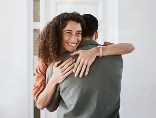 Image showing Happy, love and a couple hugging in their home for support, care or romance in marriage together. Smile, trust and security with a woman embracing her husband in their house for relationship bonding