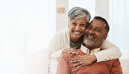 Image showing Portrait, smile and senior couple in home living room, bonding together and hug on mockup space. Happy face, man and Indian woman in lounge for care, love or support in healthy relationship at house