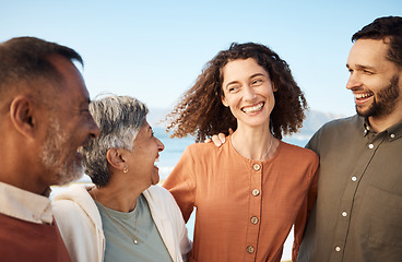 Image showing Family, parents and couple laughing at the beach for holiday or vacation together and bonding for happiness. Travel, man and woman with elderly people for happy at the sea or ocean with freedom