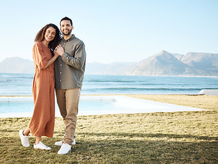 Image showing Couple, house pool and portrait with love, garden and happy from travel by the ocean. Smile, hug and gratitude from a woman and man together with care on vacation and relax at new holiday home