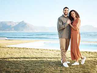 Image showing Couple, outdoor pool and portrait with love, garden and happy from travel by the ocean. Smile, hug and gratitude from a woman and man together with care on vacation and relax at new holiday home