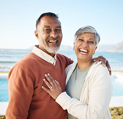 Image showing Beach, laughing and portrait of senior couple on vacation or holiday together with love in nature at sea or ocean. Elderly, man and woman relax with happiness, care and smile on retirement bonding