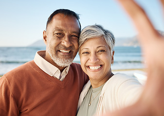 Image showing Senior couple, beach selfie and portrait with happy memory, care and bonding on vacation in summer sunshine. Man, woman and smile together for photography, profile picture or social media post by sea