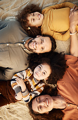 Image showing Face, family and top view of children and parents lying down together, love and happiness with bonding. Trust, support and smile in portrait, mother and father relax with young girl children