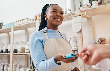 Image showing Sustainable shop, woman cashier and credit card with store and electronic transaction with small business. Worker smile, entrepreneur and happy African person with retail employee and shopping pay