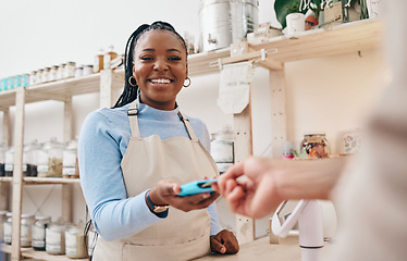 Image showing Sustainable store, woman cashier and credit card with shop and electronic transaction with small business. Worker smile, entrepreneur and happy African person with retail employee and shopping pay