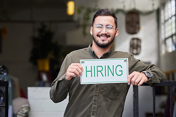 Image showing Portrait, man and we are hiring sign with recruiting, happy and smile from business owner. Male person, store and entrepreneur with recruitment poster and job search signage with manager and employee