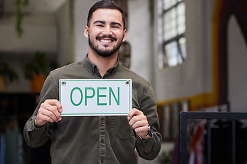 Image showing Open, sign and happy business owner working in retail, store or start of service in restaurant, cafe or coffee shop. Portugal, startup and opening with a welcome, poster or smile for portrait