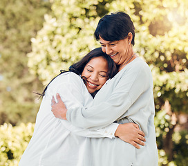 Image showing Mature woman, daughter and hug in garden with love on mothers day or women bonding with care for mom in retirement. Happy, family and embrace outdoor, backyard or together on holiday or vacation