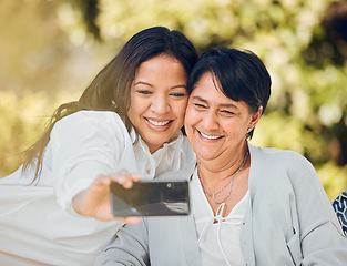 Image showing Woman, mature mother or selfie in garden on mothers day taking photograph for memory, support or love. Social media, pictures or mom with a happy daughter in outdoor park together on holiday vacation