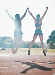 Image showing Friends, fitness and jump, women and celebrate, winning race and energy, wellness and health with support outdoor. Excited, people in air and cardio with sport, success and workout together with back