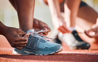 Image showing Sneakers, hands and tie lace, running and fitness with people on race track, athlete and sports outdoor. Exercise, start and runner ready for cardio, marathon or triathlon with health and shoes
