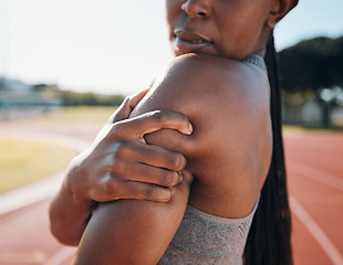 Image showing Shoulder pain, fitness and athlete with injury problem in a stadium due to outdoor exercise, training or workout. Hurt, inflammation and person or runner with muscle strain, ache or body tension