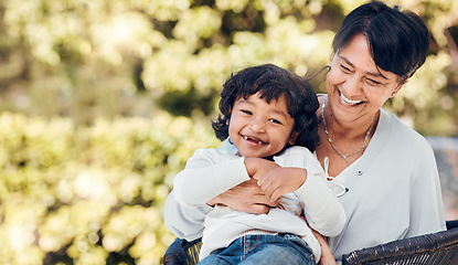 Image showing Boy, laughing and mature woman in park for bonding, support and summer break in Mexico nature. Kid, happy or funny child with grandmother on garden bench for love, trust and together in backyard hug