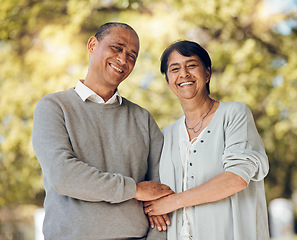 Image showing Portrait, outdoor and senior couple holding hands, love and smile with support, relationship and romance. Marriage, old man and mature woman in a park, loving together and retirement with bonding