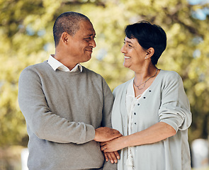 Image showing Mature couple in park, love and smile, support and trust with bonding and marriage. Life partner, retirement together and romance, people are happy outdoor with healthy relationship and care