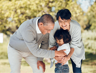 Image showing Happy, hug and grandparents with child in park for playing, love and support. Care, smile and freedom with family and embrace on nature path for peace, summer vacation and happiness together