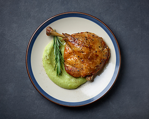 Image showing duck leg confit and broccoli puree