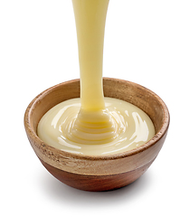 Image showing condensed milk pouring into bowl