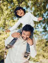 Image showing Father, fun or piggyback with child in park for bonding, games or trust in backyard garden. Smile, happy or playing dad carrying boy kid on shoulders with parent, family or support activity in nature