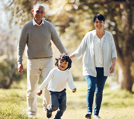 Image showing Happy, running and grandparents with child in park for playing, love and support. Care, smile and freedom with family walking on nature path for peace, summer vacation and happiness together