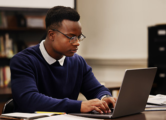 Image showing Student, learning and black man typing on a laptop in university or college campus working on assignment project. Online, studying and young person prepare for internet exam or doing research