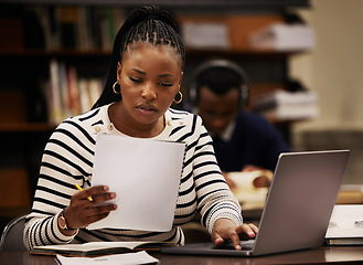 Image showing Student, woman and documents on laptop in library for study, research and planning in university. Young african person with paper and computer for reading or focus in English, education or philosophy