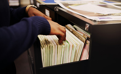 Image showing File cabinet, legal documents and person hands with management of tax report at office. Accountant, worker and notes in a workplace for corporate audit and paperwork documentation for debt books