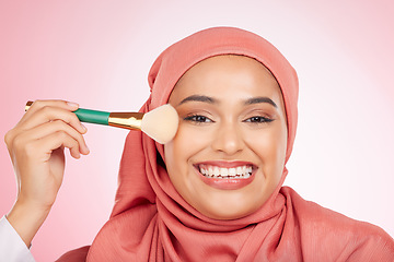 Image showing Makeup, brush and muslim woman portrait with a smile from cosmetics and blush in studio. Facial, glow and happy female person with beauty, skincare and shine with a hijab and skin tool for face