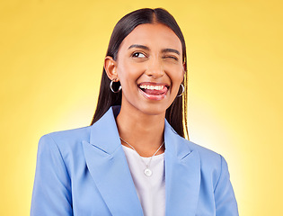 Image showing Funny, business woman and smile with silly and tongue out in a studio. Comedy, female employee and yellow background with emoji and comedy face of a employee with modern fashion and trendy style