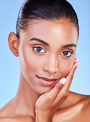 Image showing Beauty, health and skincare with portrait of woman in studio for cosmetics, dermatology and facial. Glow, self care and wellness with person on blue background for spa treatment, grooming and makeup