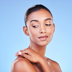 Image showing Beauty, glow and skincare with face of woman in studio for cosmetics, dermatology and facial. Health, self care and wellness with person on blue background for spa treatment, grooming and makeup