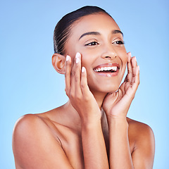 Image showing Beauty, smile and skincare with face of woman in studio for cosmetics, dermatology and facial. Glow, self care and wellness with person on blue background for spa treatment, grooming and makeup