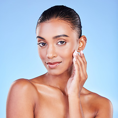 Image showing Woman, natural beauty and portrait with skincare, face cleaning and skin glow in studio. Facial, female model and cosmetics with dermatology, self care and collagen treatment with blue background