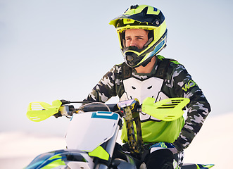 Image showing Sports, desert and man on motorbike thinking about race training, workout and challenge on sand. Extreme transport, travel and cyclist with helmet on motorcycle for adventure, freedom and adrenaline