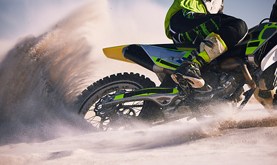 Image showing Sand, desert and person on motorbike in action for race training, workout and speed challenge in sports. Extreme transport, travel and cyclist with motorcycle for adventure, freedom and adrenaline