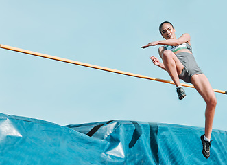 Image showing High jump, woman and sport with exercise, cardio and athlete in competition outdoor. Jumping, workout and training for performance with action, energy and contest with female person and mockup space