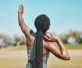 Image showing Woman, shot put and athlete throw in competition, challenge or training in field event with metal or steel weight. Throwing, ball or African female outdoor for athletics sport, game or strong contest