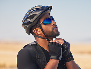 Image showing Cycling, sports and fitness with man and helmet in road for training, challenge and performance, Health, workout and wellness with person and safety gear in nature for freedom, adventure and exercise