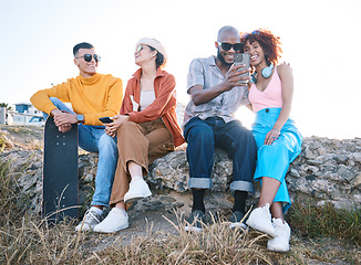 Image showing Gen z, friends and relax outdoor with phone, vacation and skateboard for selfie, memory and conversation in nature. Young men, women and students with smile, smartphone and summer memory in Cape Town