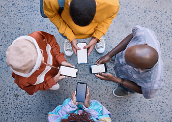 Image showing Friends, circle and phone in top view, outdoor and texting on social media, app and web communication. Group, gen z students or people with smartphone, internet and contact in urban street in city