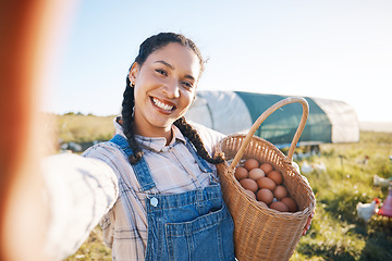 Image showing Farm, harvest and woman in selfie with basket, eggs and working with chicken, product and sustainability in agriculture business. Female farmer and field in countryside, spring farming and egg photo