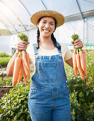 Image showing Farming, portrait of woman with carrots and smile at sustainable small business, agriculture and natural food. Girl working at happy agro greenhouse, vegetable growth in garden and eco friendly pride