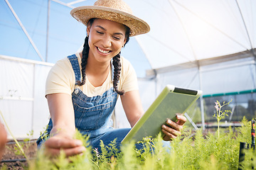 Image showing Woman, agriculture and tablet for gardening herbs, plants and check growth in greenhouse. Happy farmer, digital tech or farming app for agro food production, leaf inspection and sustainable business