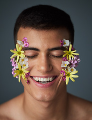 Image showing Face, happy man and flowers, beauty and natural, cosmetics and art deco isolated on studio background. Nature aesthetic, smile in portrait and dermatology, eco friendly skincare and clean with spring
