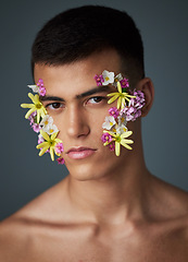 Image showing Portrait, man and flowers, beauty and natural, cosmetics and headshot with art deco isolated on studio background. Nature aesthetic, face and dermatology, eco friendly skincare and clean with spring