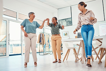 Image showing Women in creative office, dancing together and excited for achievement, success and small business sales goals. Celebration, diversity and happy employees at fun fashion design studio with smile.